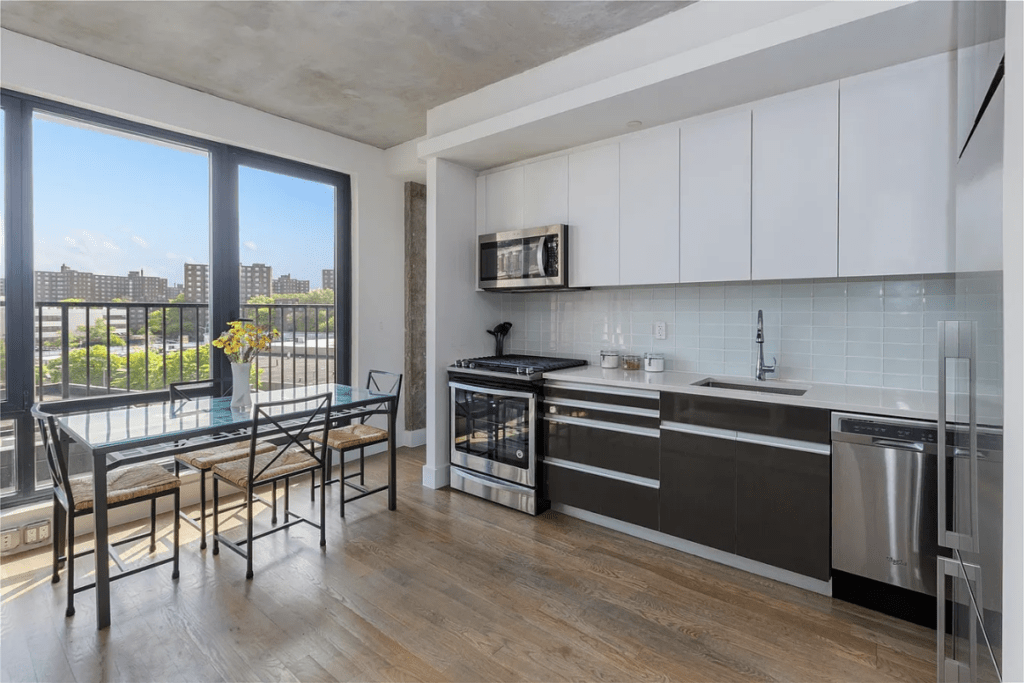 Modern kitchen and dining area featuring large windows