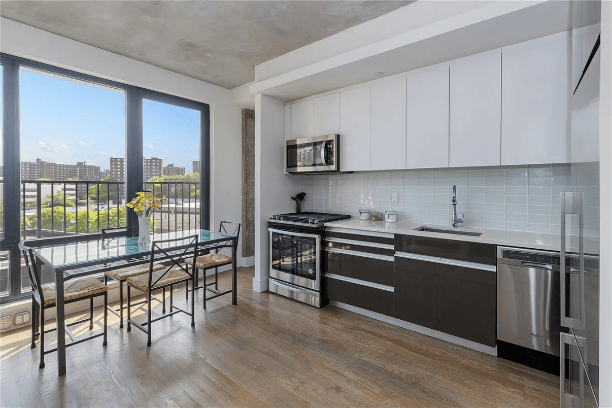 Modern kitchen and dining area featuring large windows