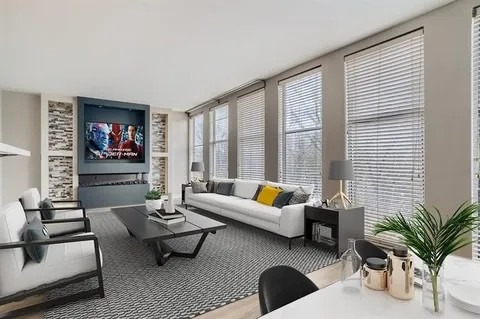 Modern living room featuring a sleek design with white sofas