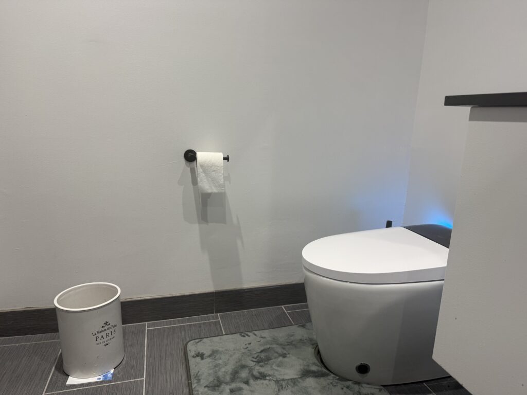 Modern restroom featuring a sleek toilet